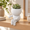 Rally Moss badminton planter in a warm styled shelf setting