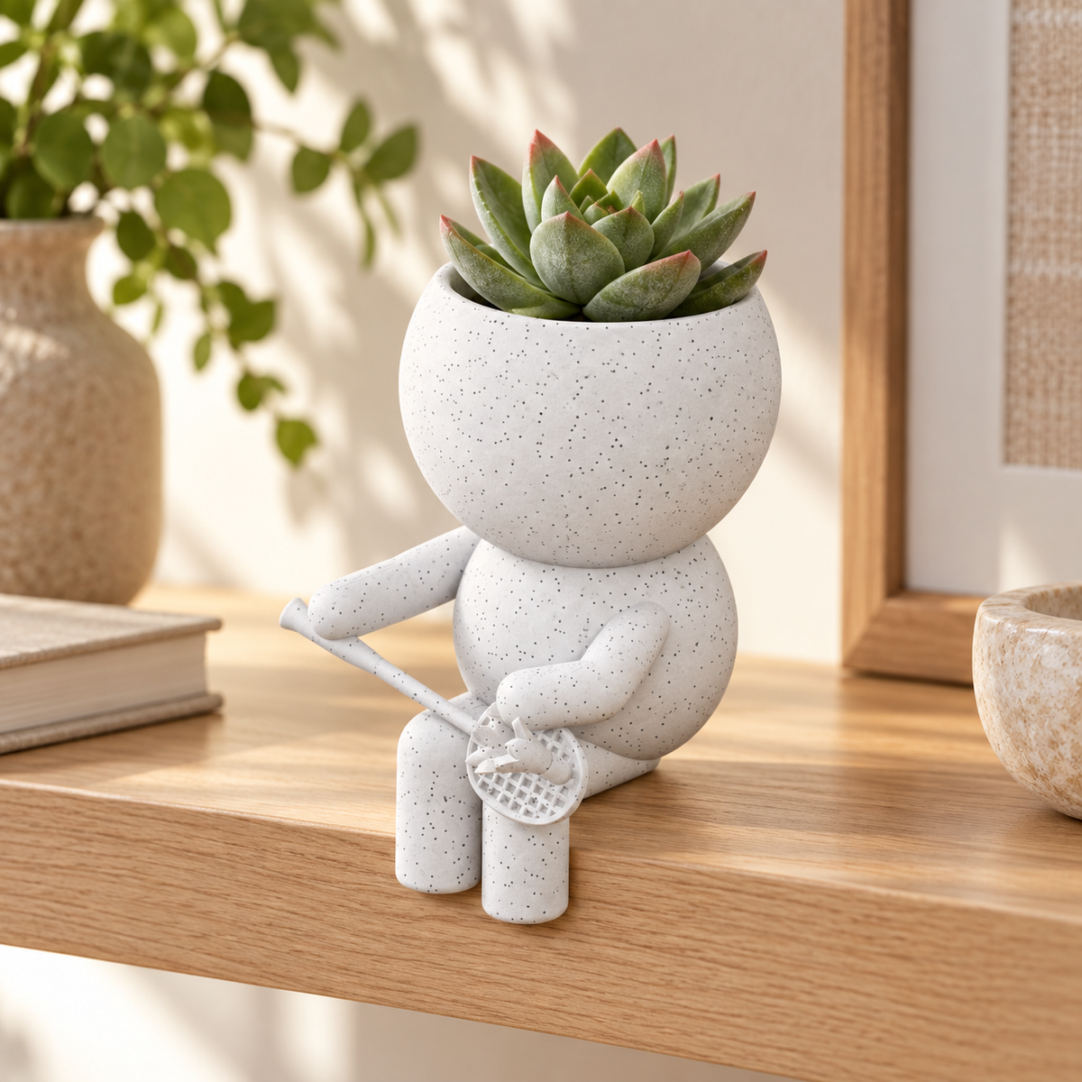 Rally Moss badminton planter in a warm styled shelf setting