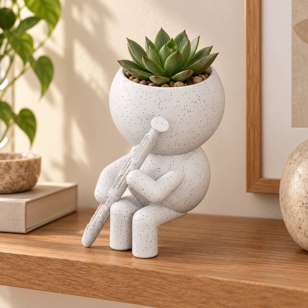 Reed Reed bassoon planter in a warm styled shelf setting