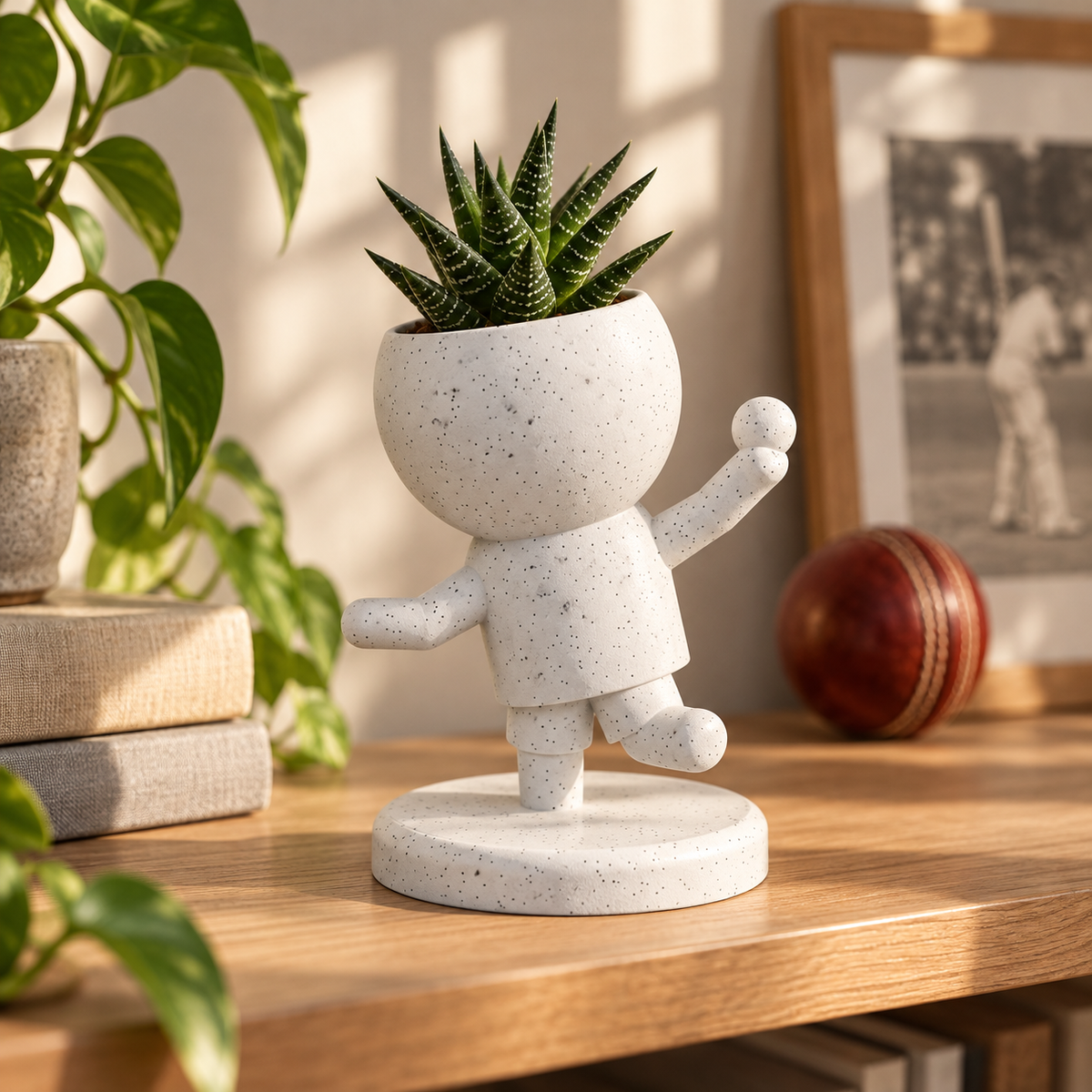 Spin Sprout Makes the Play | Cricket Bowler Planter editorial view