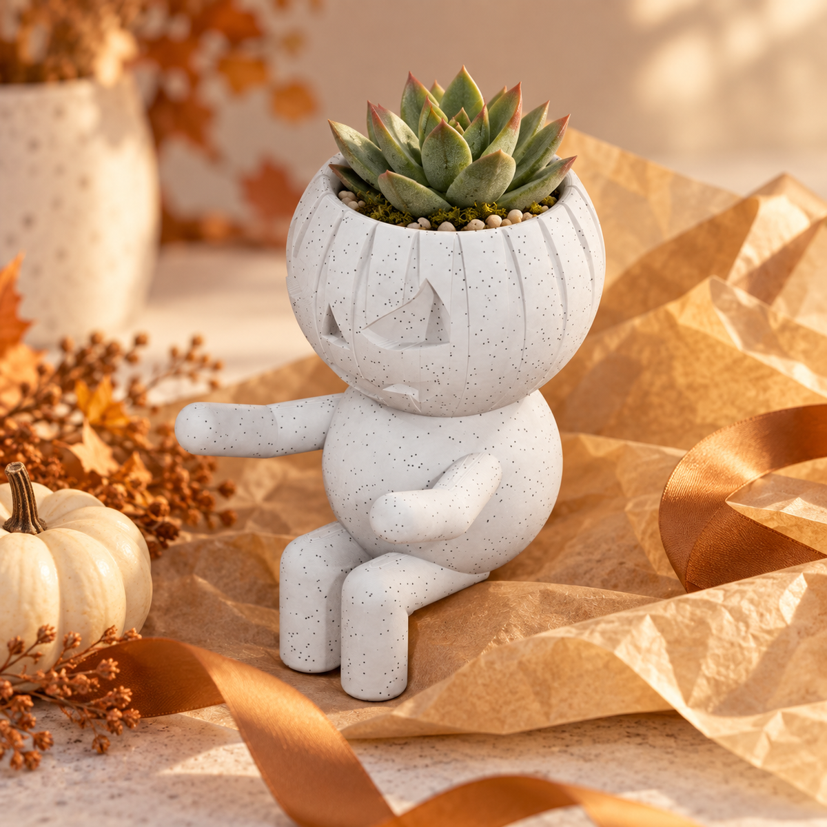 Pumpkin Pippin jack-o-lantern planter presented as a gift