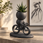 Cadence Rides On racing cyclist planter editorial view