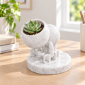 Tuck character planter hero view
